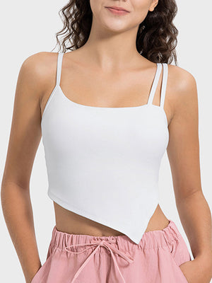 White asymmetric cutout cami tank top with double straps and a handkerchief hem.