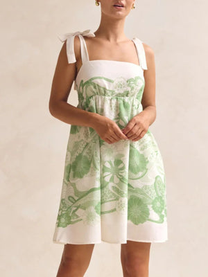 Green floral tie-strap mini dress with square neckline and pockets