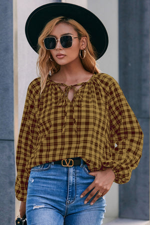 Gingham gathered neckline blouse in mustard with balloon sleeves and tie detail.