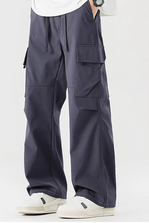 Dark gray cargo pants for men with multiple pockets and drawstring waist.