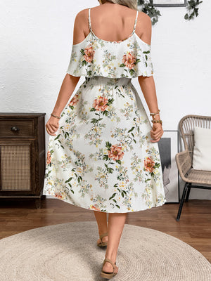 Floral print cold shoulder dress with ruffled neckline and spaghetti straps.