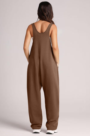 Relaxed fit chocolate brown jumpsuit with oversized pockets and wide legs.