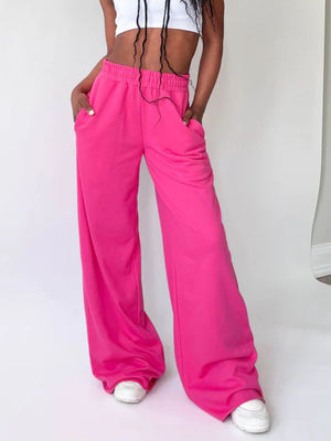 Hot Pink wide-leg lounge pants with pockets and drawstring waist.