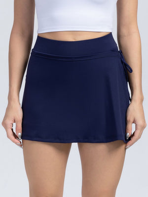 Dark blue wrap-detail skort with side tie and elastic waistband.