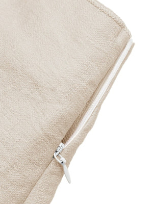 Beige linen mini skirt with asymmetrical hem and side zipper detail
