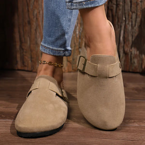 Suede buckle mules in mocha with cork sole detail and adjustable strap.