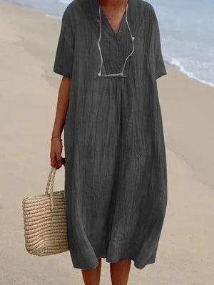 Dark gray V-neck casual midi dress with short sleeves and textured fabric.