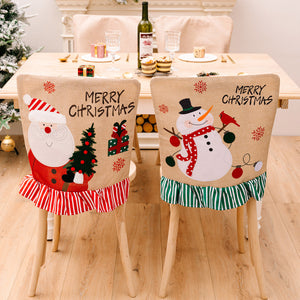 Christmas chair covers with Santa and snowman designs, ruffled trim in red and green.