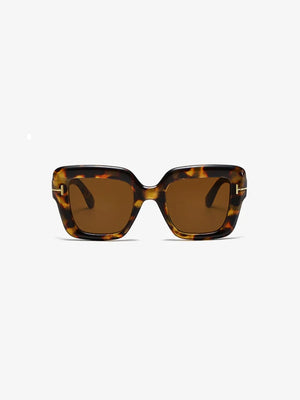 Geometric acetate sunglasses in brown tortoise shell with tinted lenses.