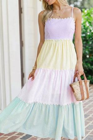 Maternity tiered dress with pastel colorblock stripes, scalloped trim, and spaghetti straps.