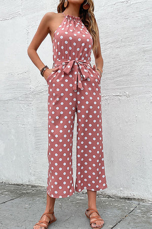 Pink polka dot halter neck palazzo jumpsuit with tie waist and pockets