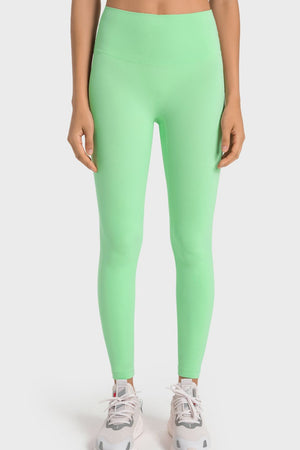 Green seamless high-waist performance leggings with a sculpted fit.