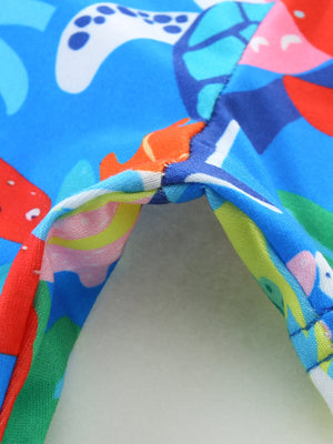 Toddler dress with colorful ocean print featuring turtles and fish.