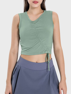 Asymmetric ruched crop tank top in gum leaf with drawstring detail