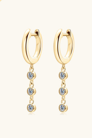 Gold dangling gemstone sterling hoop earrings with three clear cubic zirconia stones.
