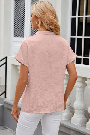 Textured watermelon pink blouse with rolled sleeves and V-neck
