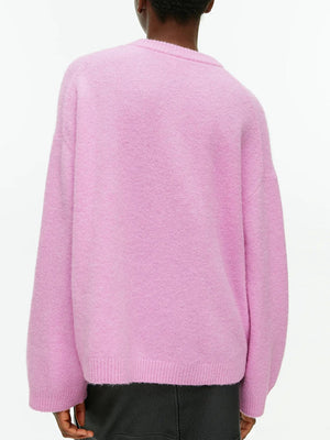 Pink oversized brushed knit crewneck sweater with ribbed cuffs and hem