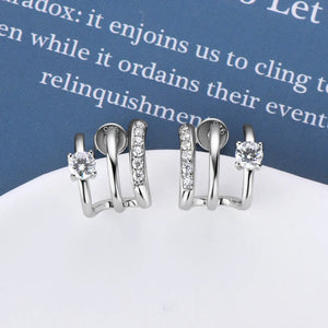 Triple-bar crystal stud earrings in silver with D color grade stones.