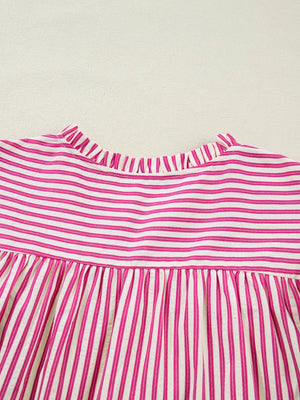 Maternity blouse with pink and white stripes, ruffled neckline, and shirred yoke.