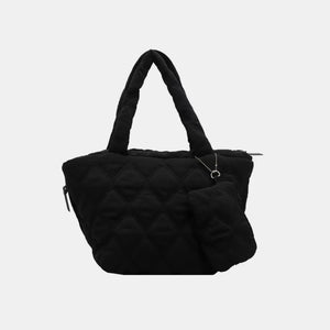 Black quilted shopper tote bag with diamond pattern and matching coin purse accessory.