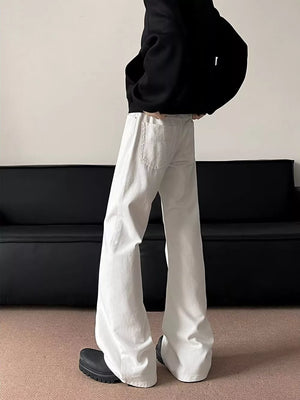 White oversized wide-leg sweatpants with back pockets and a relaxed drape.