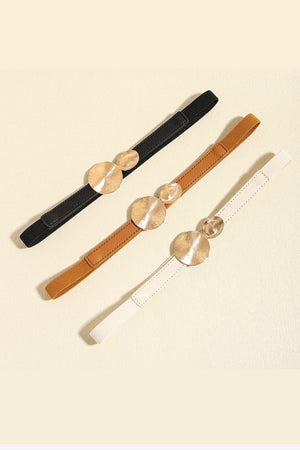 Black, caramel, and ivory elastic belts with disc detail and alloy buckle.
