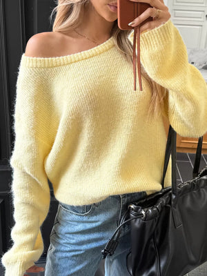 Pastel yellow ribbed knit one-shoulder sweater with long sleeves.