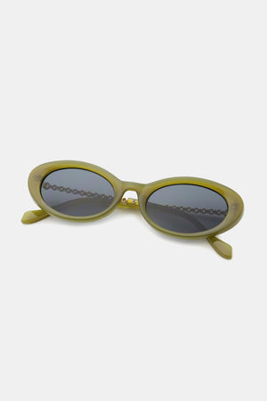 Matcha green oval sunglasses with chain detail and dark lenses.