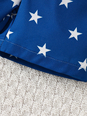 Blue cotton baby shorts with white stars and elastic waistband detail.