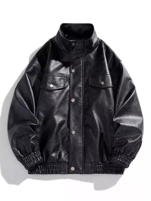 Black oversized faux leather bomber jacket with snap buttons and chest pockets.