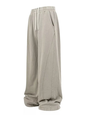 Luxe drawstring wide leg sweatpants in light gray with pockets and contrast stitching.