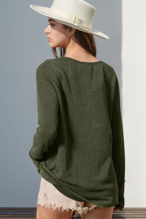 Moss green waffle knit henley shirt with thumbhole cuffs and a relaxed fit.