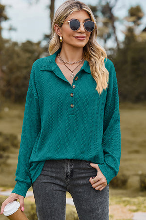 Teal textured polo-neck sweater with button detail and long sleeves.
