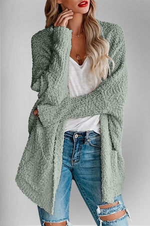 Textured popcorn knit open cardigan in Gum Leaf green with long sleeves and pockets.