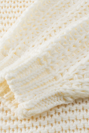 Textured knit cocoon cardigan in cream with a waffle knit pattern.