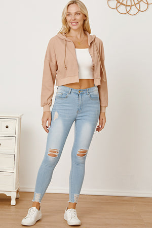 Waffle knit cropped zip hoodie in khaki with drawstring hood and cuffed sleeves.