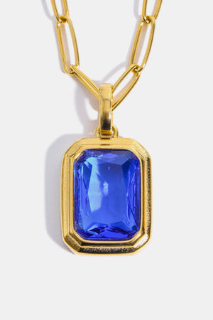 Gilded Prism Pendant Necklace with royal blue gem and 18K gold chain.