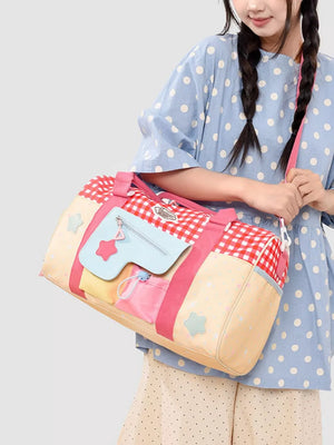 Charming gingham duffel bag with star patches and front pockets.