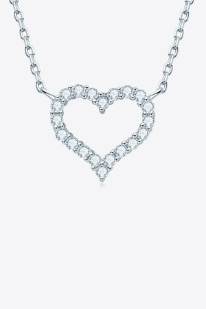 Silver heart pendant necklace with diamond embellishments on a delicate chain.