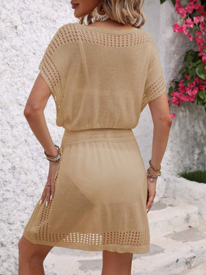 Beige mesh dress with V-neck, short sleeves, and crochet details.