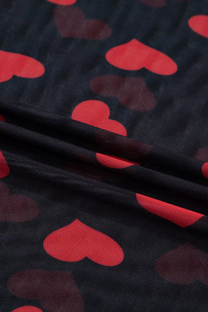 Sheer mesh blouse with red heart print on black fabric