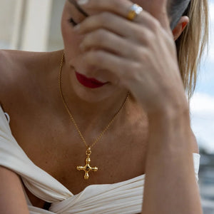 Gold Byzantine-inspired cross pendant necklace with gemstone detail