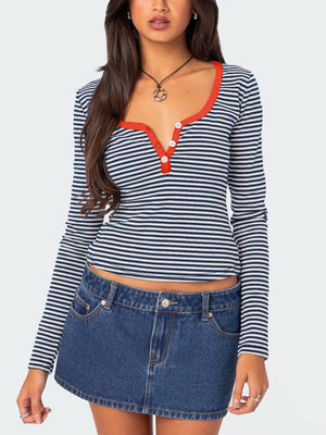 Striped Henley with contrast collar and buttons, navy and white stripes, long sleeves.