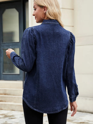 Dark blue denim blouse with ruffled puff sleeves and button cuffs.