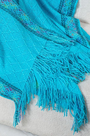 Sky blue acrylic knit hooded wrap with embroidered trim and fringe detail