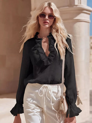 Black V-neck maternity shirt with ruffled neckline and cuffs.