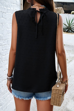 Black textured yoke dot tank top with ruffled neckline and tie back detail