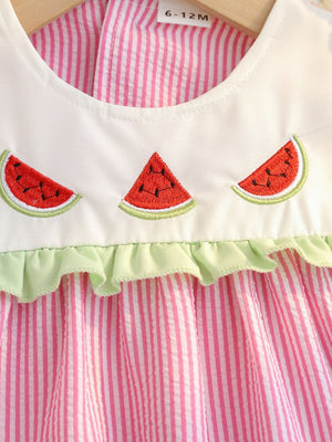 Embroidered fruit baby dress in pink seersucker with white collar and green ruffle trim.