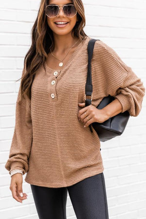 Waffle knit henley pullover in camel with button detail and v-neck.