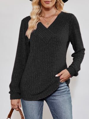 Textured ribbed V-neck pullover sweater in black with long sleeves and a casual fit.